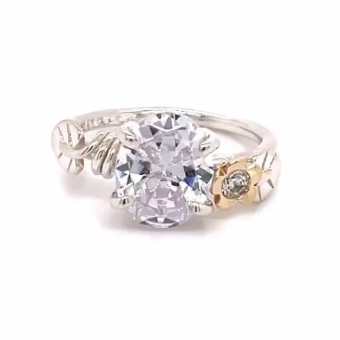 rikke_harsheim_ring_med_b_0.webp RIKKE HARSHEIM RING MED BLADER OVAL STEN OG GULLBLOMST SMAL RINGSKINNE 2MM